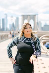 Picture of Dr. Farah Laurent standing on a bridge. 