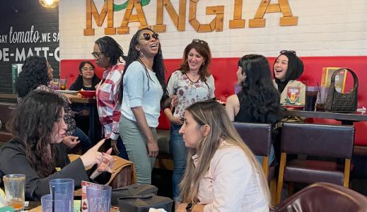 Group of people talking and laughing